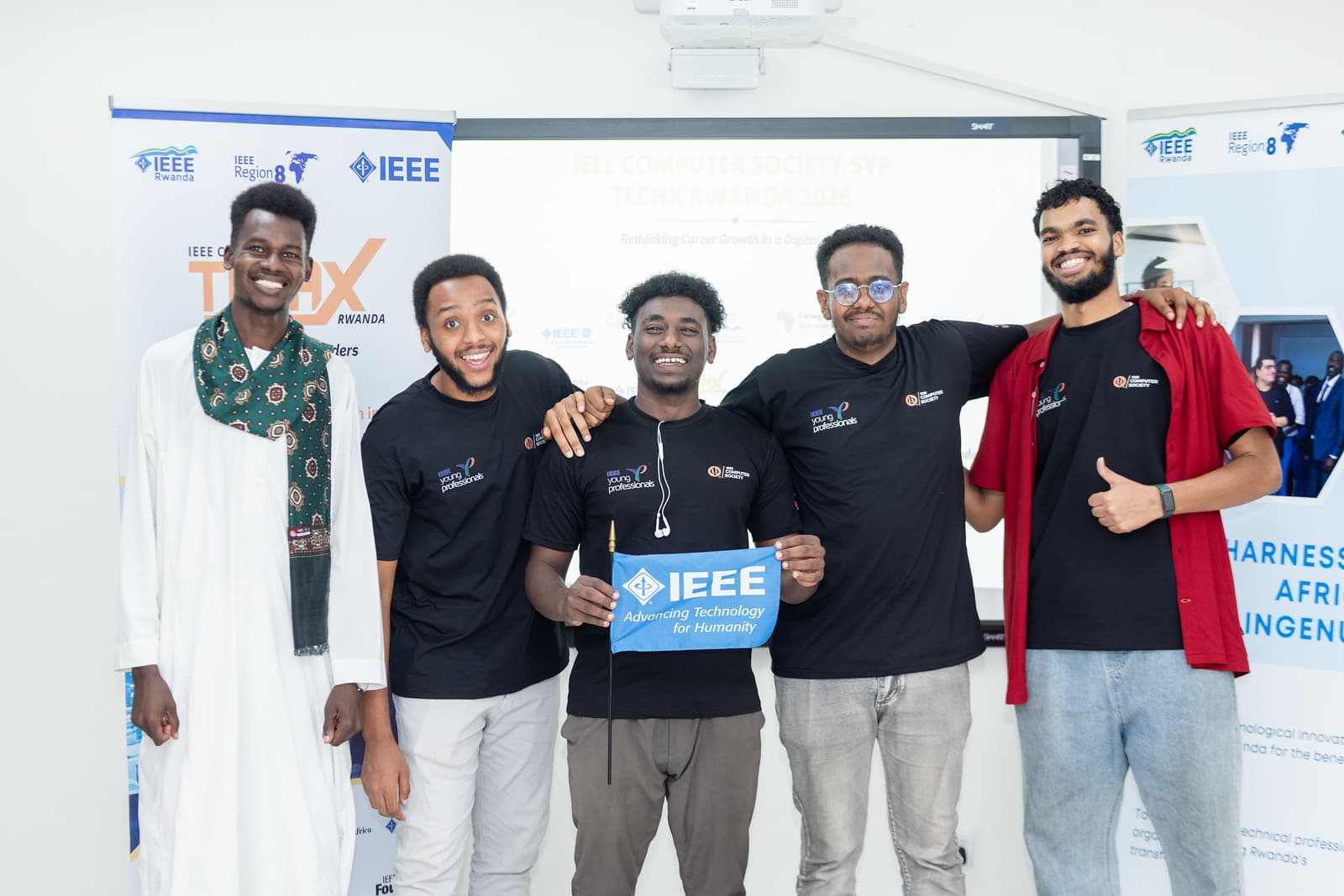 TechX Rwanda participants together with an IEEE sign